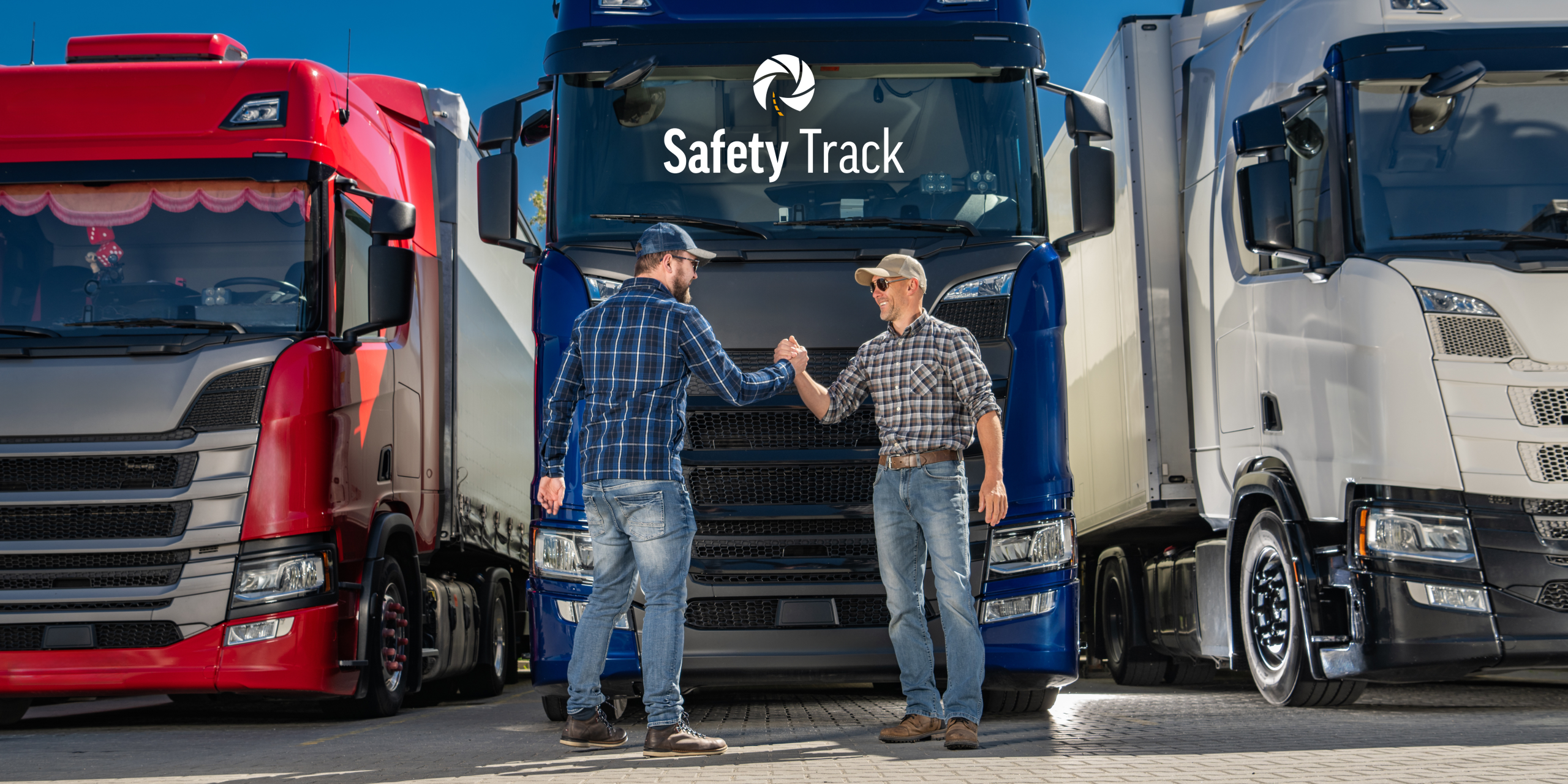 Two truck drivers shaking hands in front of three large trucks, featuring the Safety Track logo, highlighting camaraderie and appreciation during National Truck Driver Appreciation Week.
