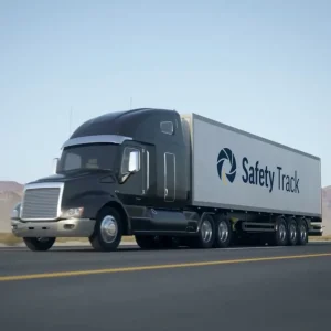 Black semi-truck with a large trailer featuring "Safety Track" logo, driving on a highway.